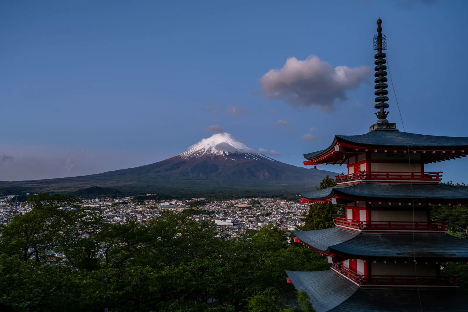 Scenic view of Mount Fuji with Chureito Pagoda, capturing Japan's iconic landscape during twilight