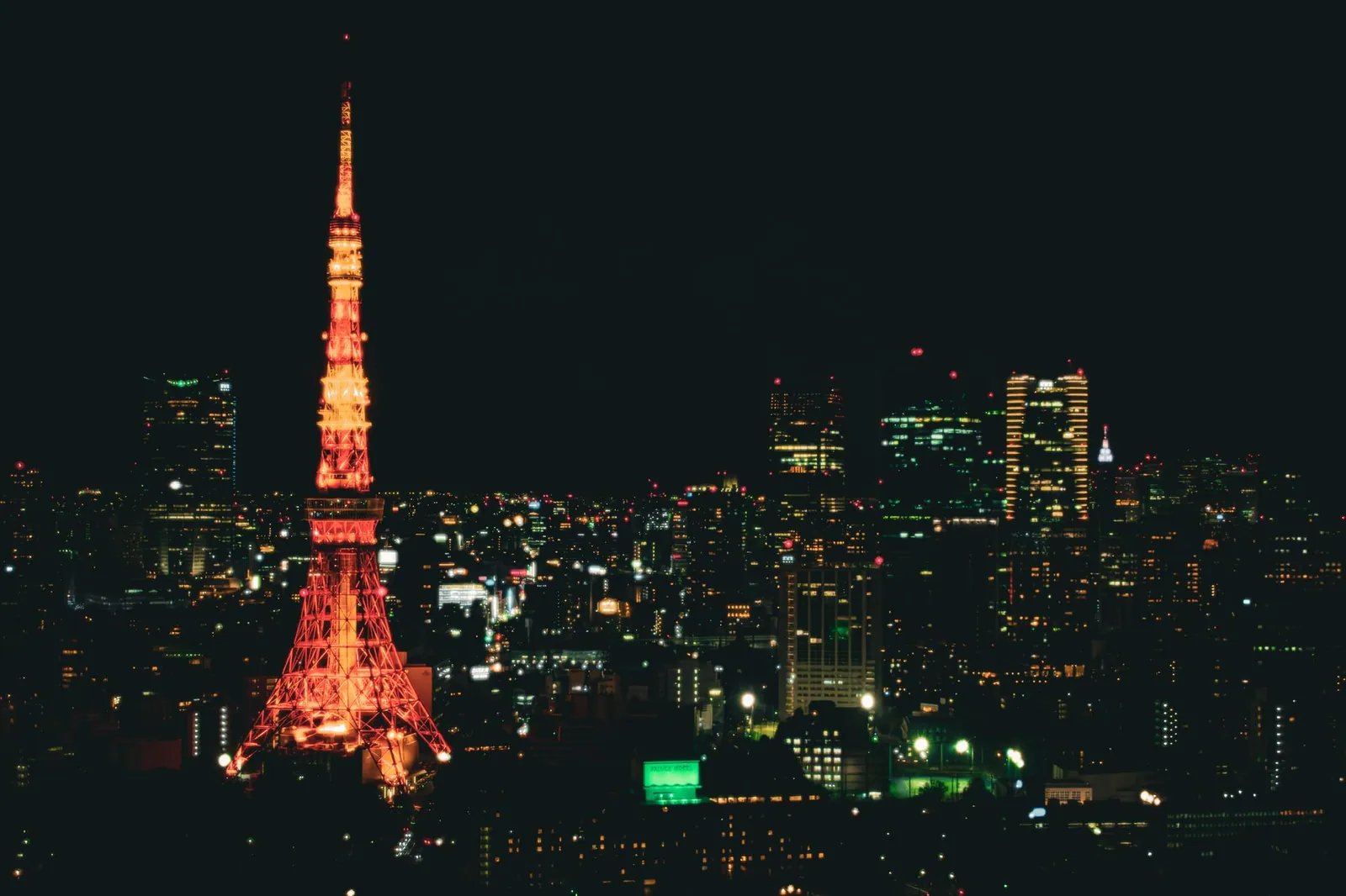 Night view of Tokyo's cityscape with the illuminated Tokyo Tower