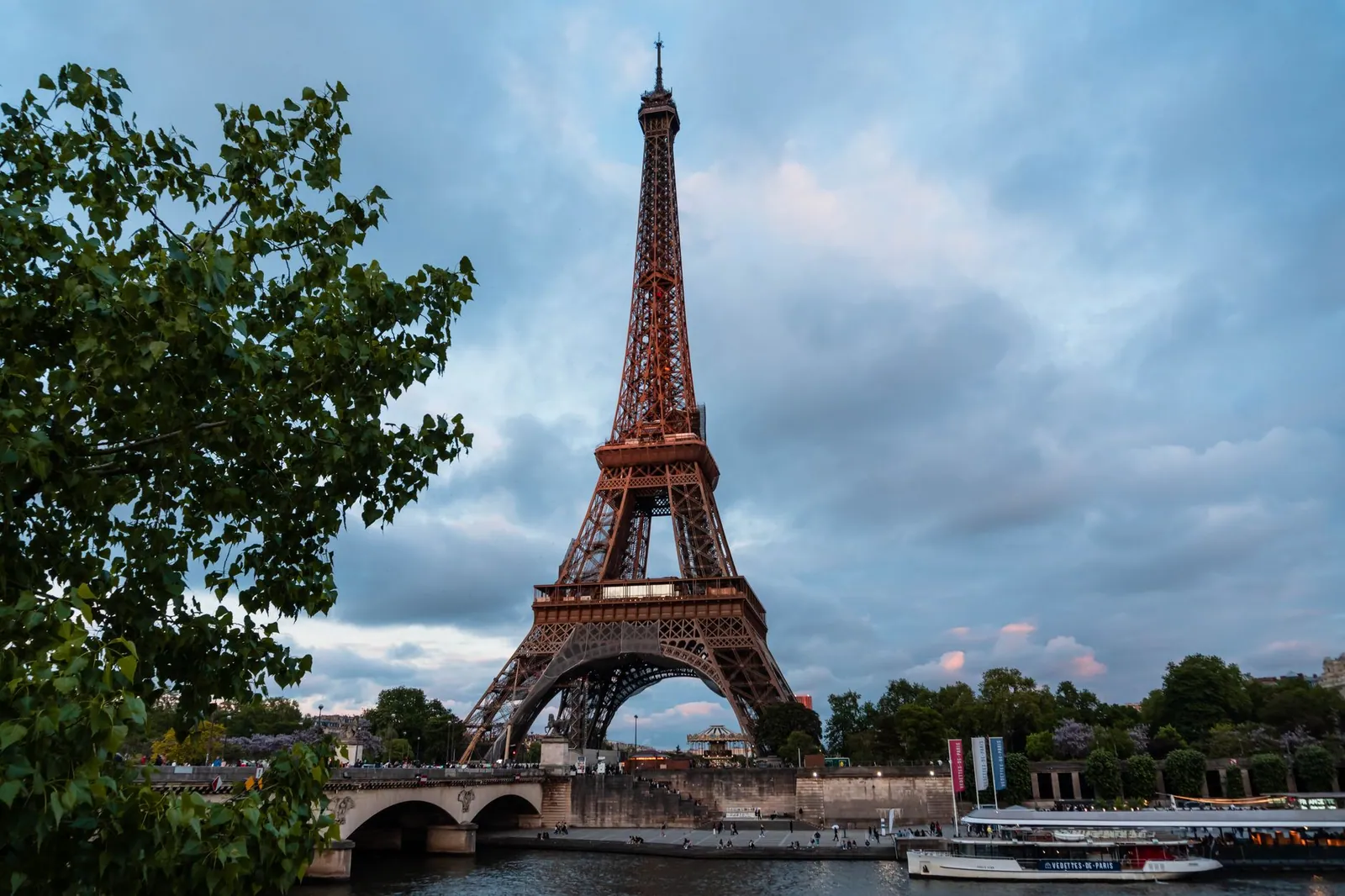 Scenic view of the Eiffel Tower and Seine River during sunset in Paris, France