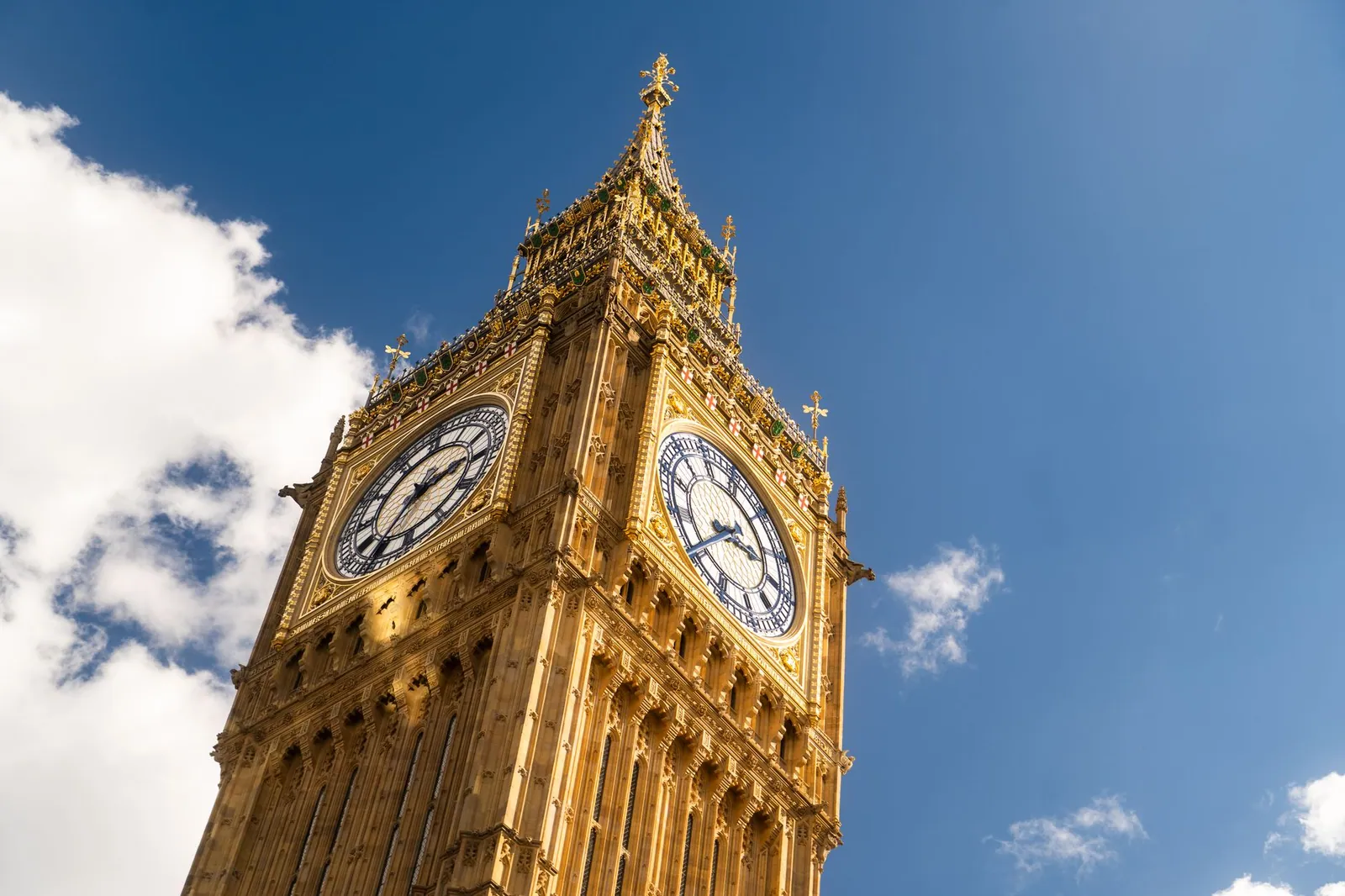 The iconic Big Ben clock tower in London against a clear blue sky