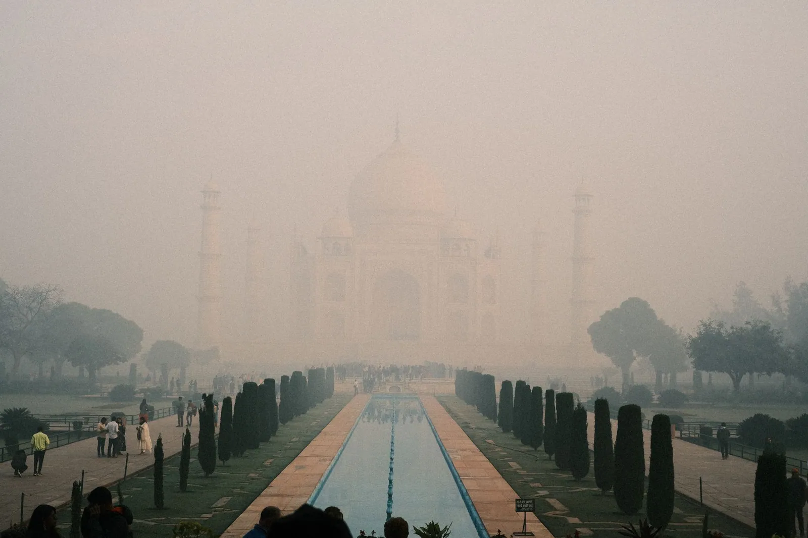 Foggy morning at the Taj Mahal in Agra, India, showing its ethereal beauty amid heavy fog