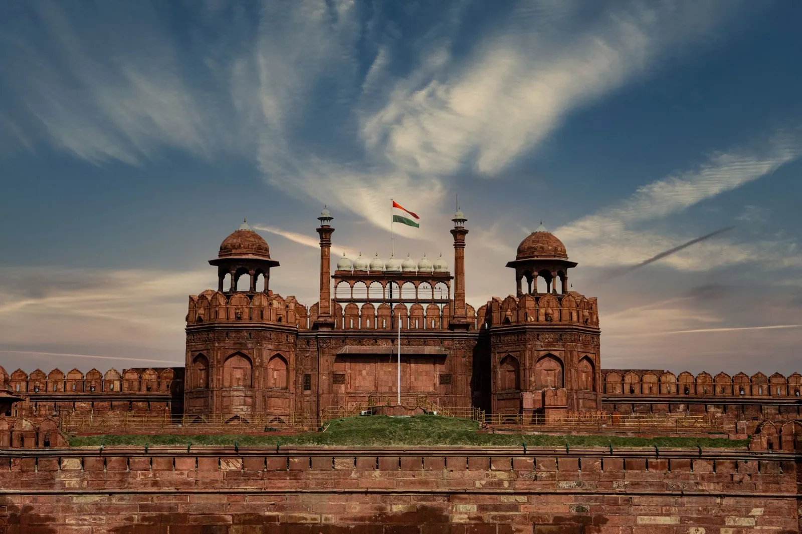 A stunning view of the Red Fort in New Delhi showcasing its historic architecture and Indian flag.