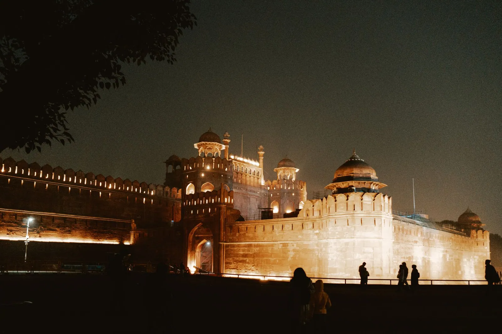 Night view of the majestic Red Fort in New Delhi, India, beautifully illuminated under the night sky.