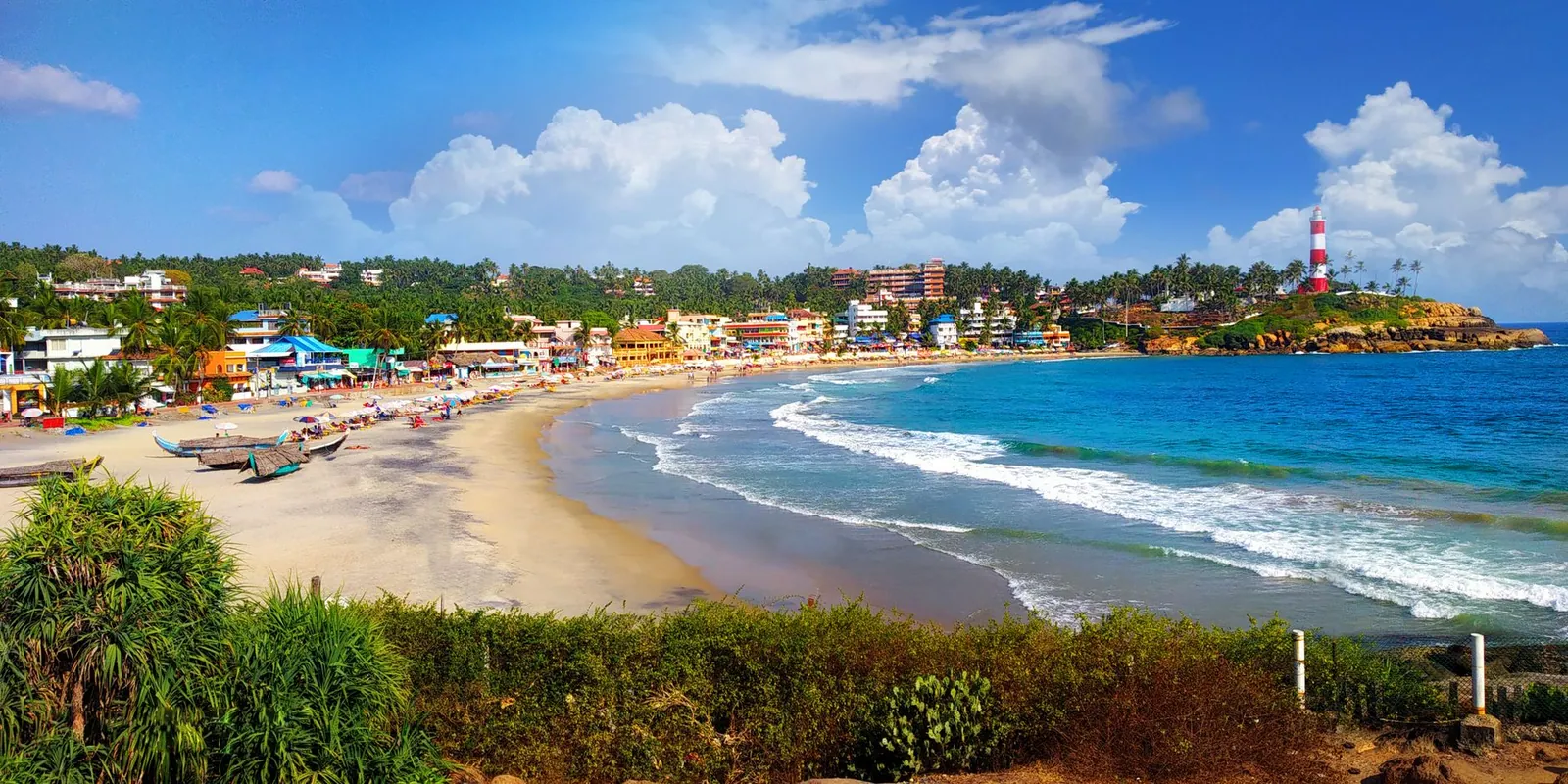 A view of a coastal town and lighthouse on India's west coast
