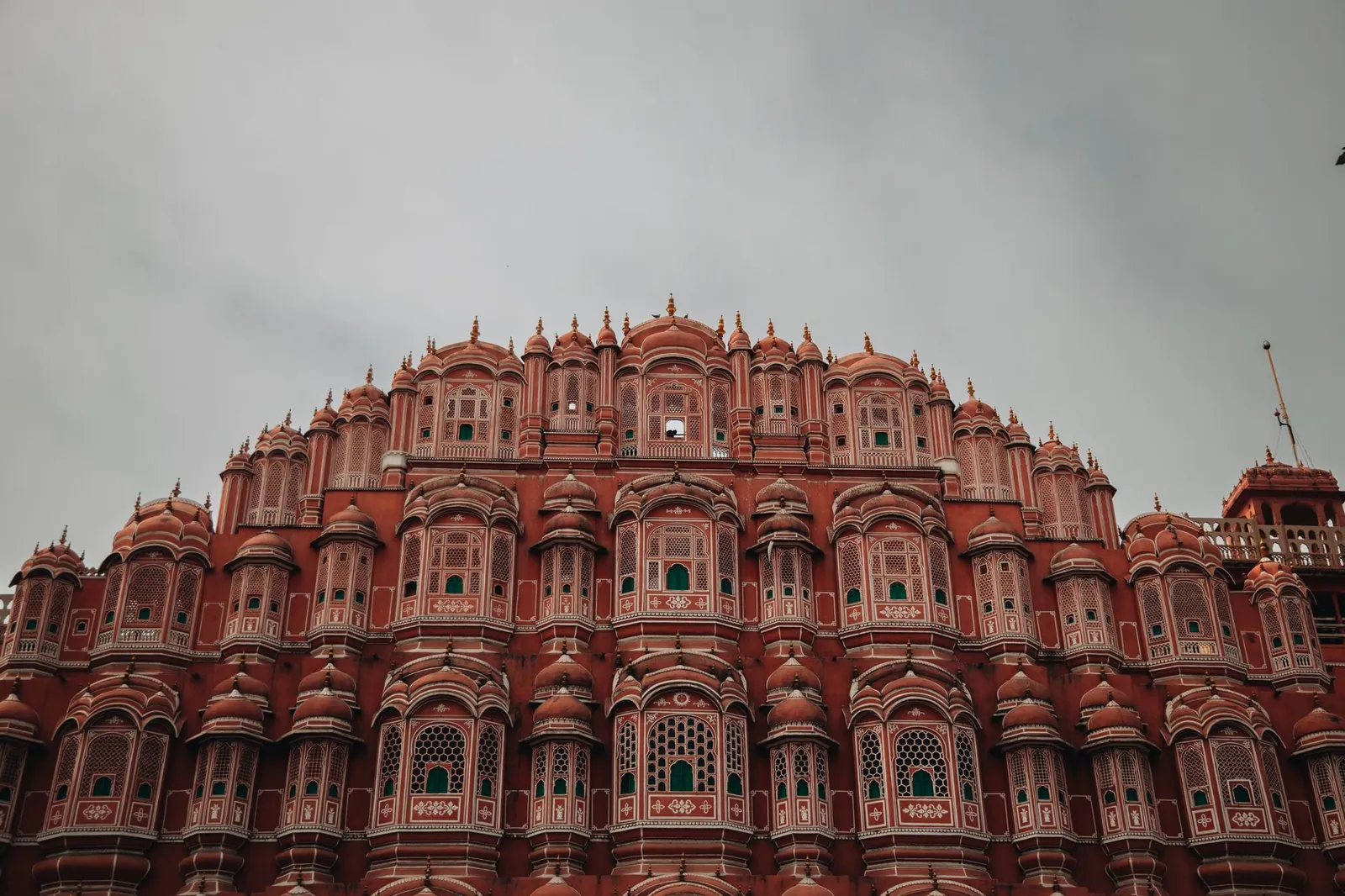 The iconic Hawa Mahal's pink sandstone facade in Jaipur, India