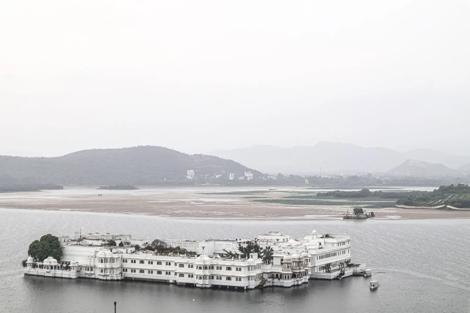 A serene view of the famous Lake Palace on Lake Pichola in Udaipur, India