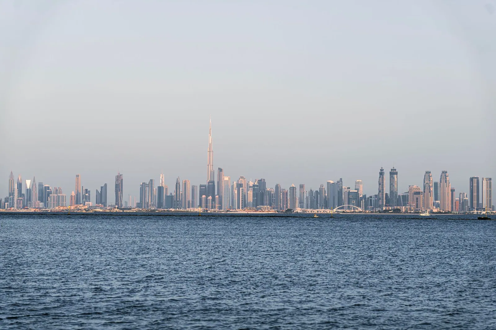 A view of Dubai's skyline featuring the Burj Khalifa across the sea