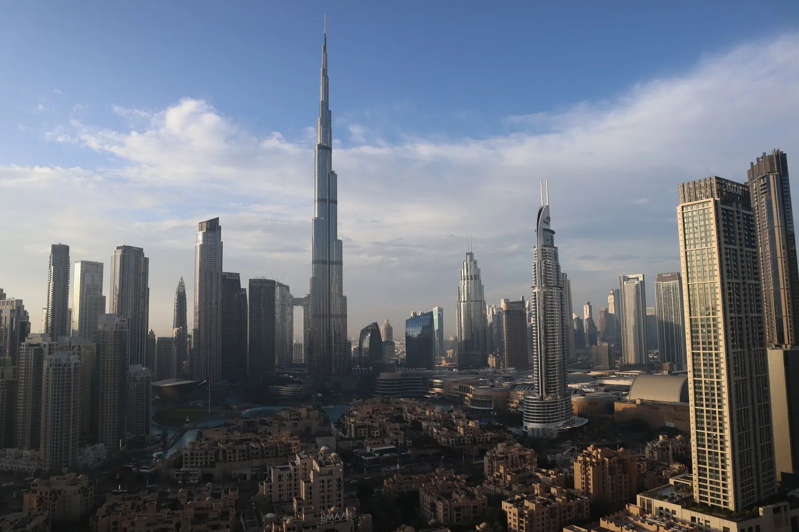 A stunning view of Dubai's skyline with the iconic Burj Khalifa under a clear blue sky