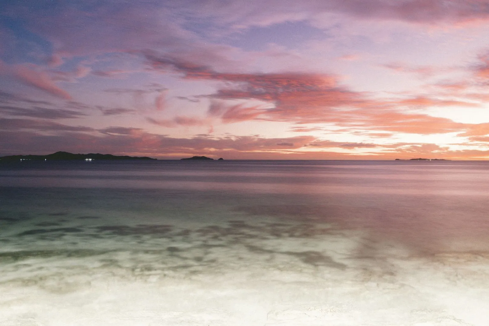 Sunset over the Pacific Ocean in Nadi, Fiji, with a calm sea