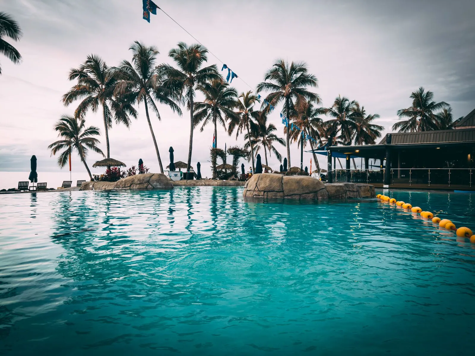 Poolside with palm trees at a resort in Fiji