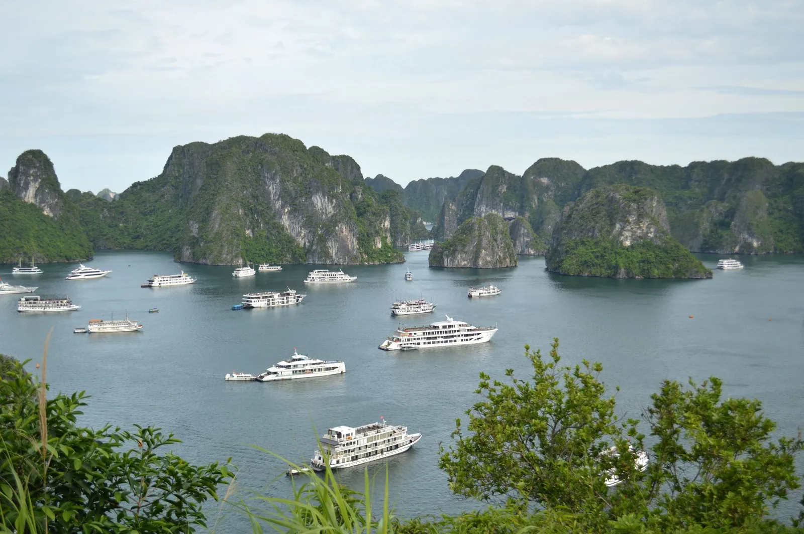 Limestone islands and cruise boats in Ha Long Bay, Vietnam